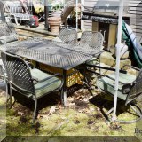 L20. Metal patio table and 6 chairs.